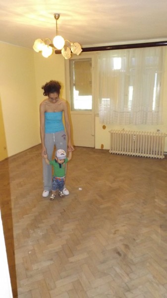 The living room, large by Romanian standards. The original flooring is in decent condition. Yup, that's Baby Romanian who's starting to learn how to walk.