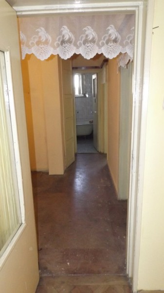 The other bit of the hallway, leading to the bathroom and the bedrooms
