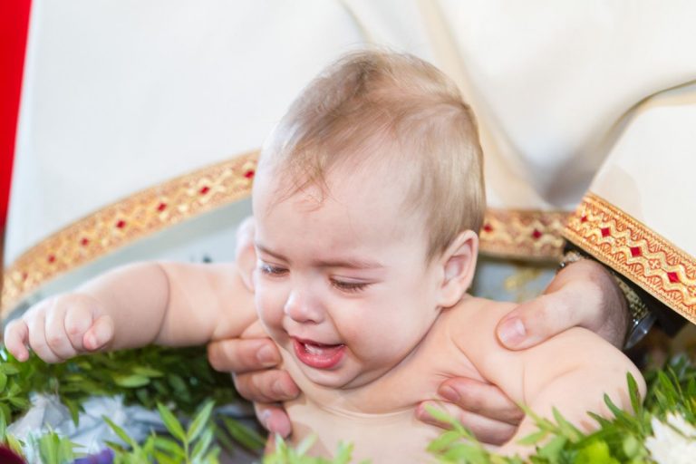 Baptism baby sunk in water