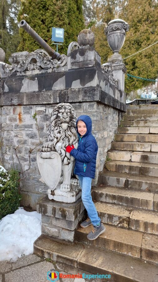 statues at the entrance to the Peles Castle