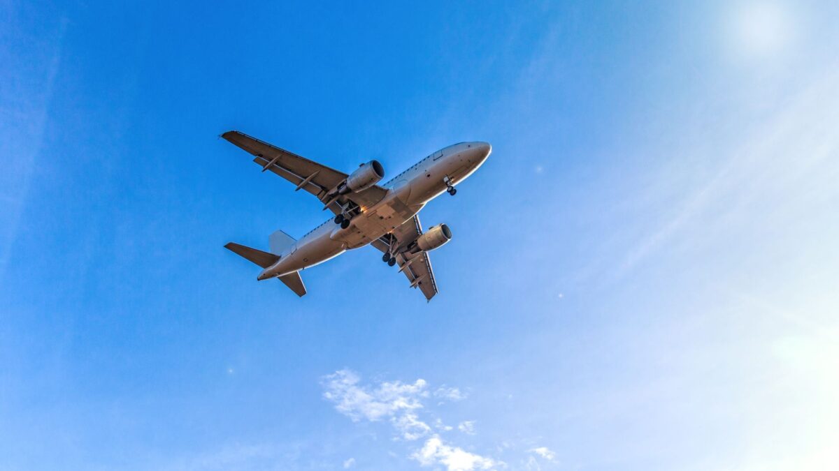 plane flying towards international airport in Romania