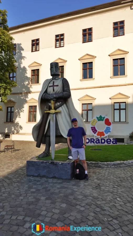Me posing with a knight statue at the Oradea Citadel