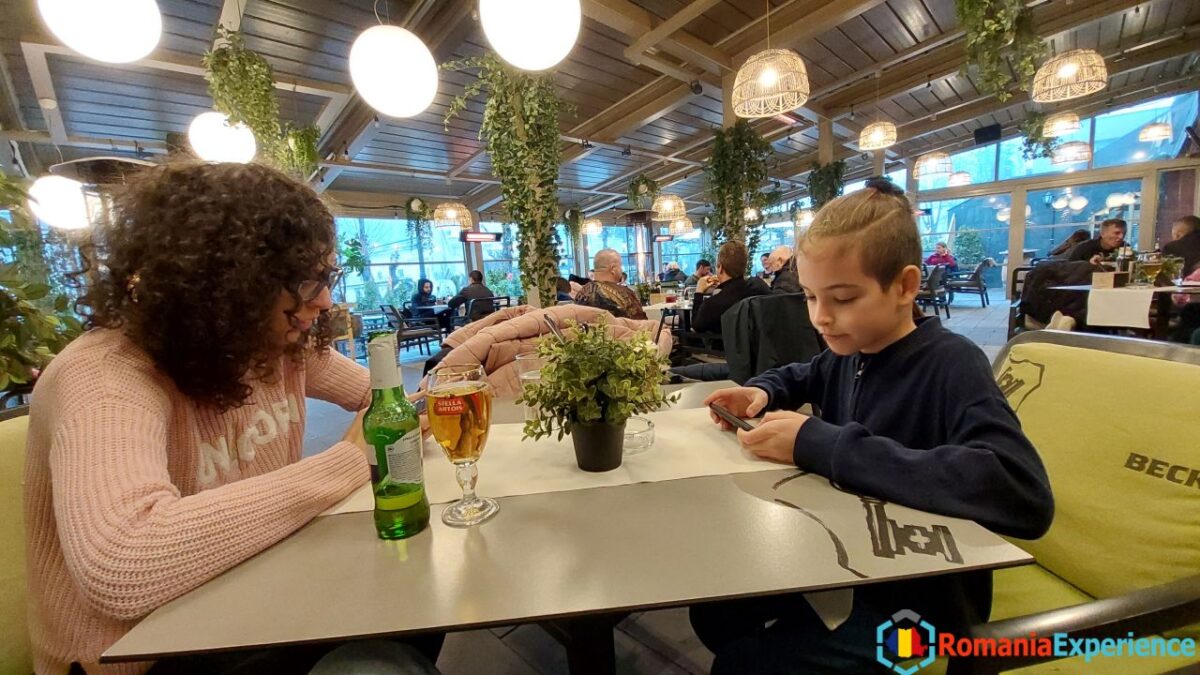 My family waiting for food at Apres restaurant in Sinaia