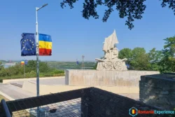 Flags of Romania and the EU waving in the wind in Calafat